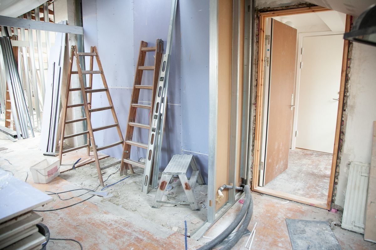 Partition framing, service openings and site preparation before furniture installation