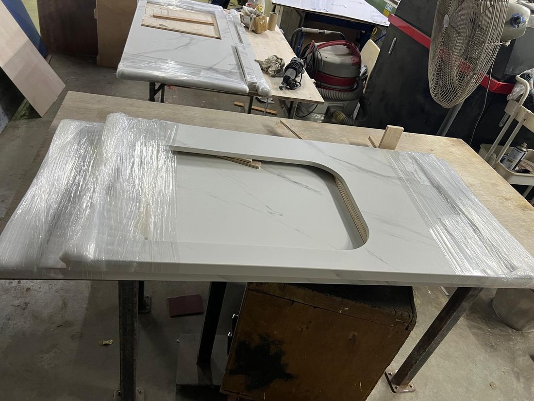 Stone worktop being cut and edge-finished according to an approved template
