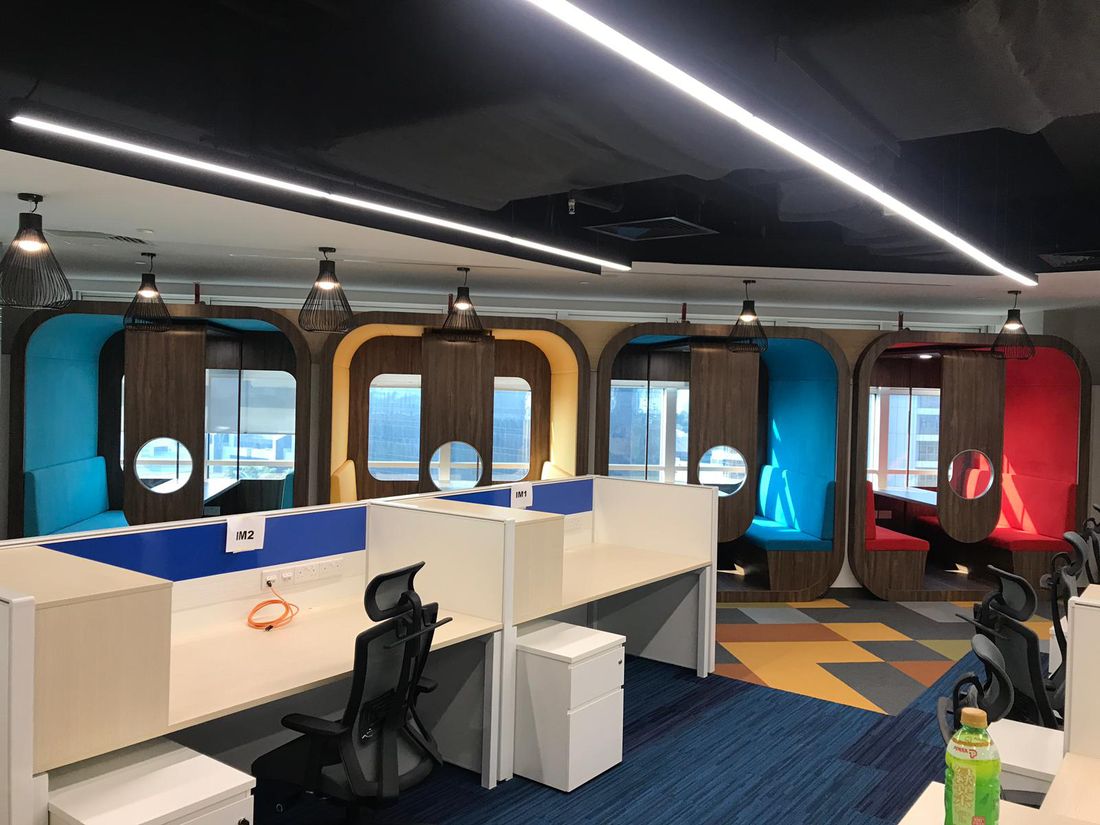 FF&E Receiving, Logistics and Installation for Commercial Projects in Singapore Completed corporate office with installed workstations, booths and loose furniture