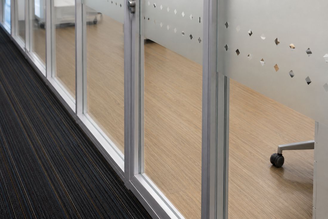 Frosted manifestation band applied to an office glass partition
