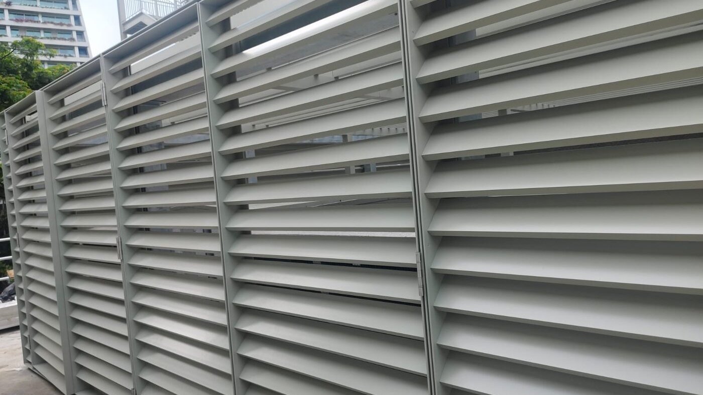 Completed powder-coated aluminium louvre screens installed on a Singapore project.