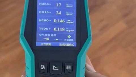 E0 vs E1 Plywood: What the Test Numbers Actually Mean A handheld indoor air quality meter displaying formaldehyde and TVOC readings while resting on a timber surface.