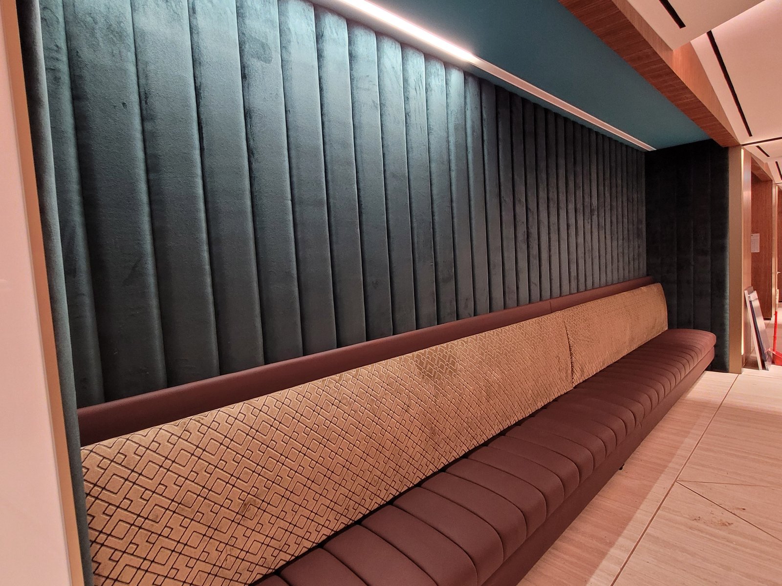 Acoustic Panel Supply & Installation in Singapore Upholstered wall panels above a built-in banquette in a Singapore office
