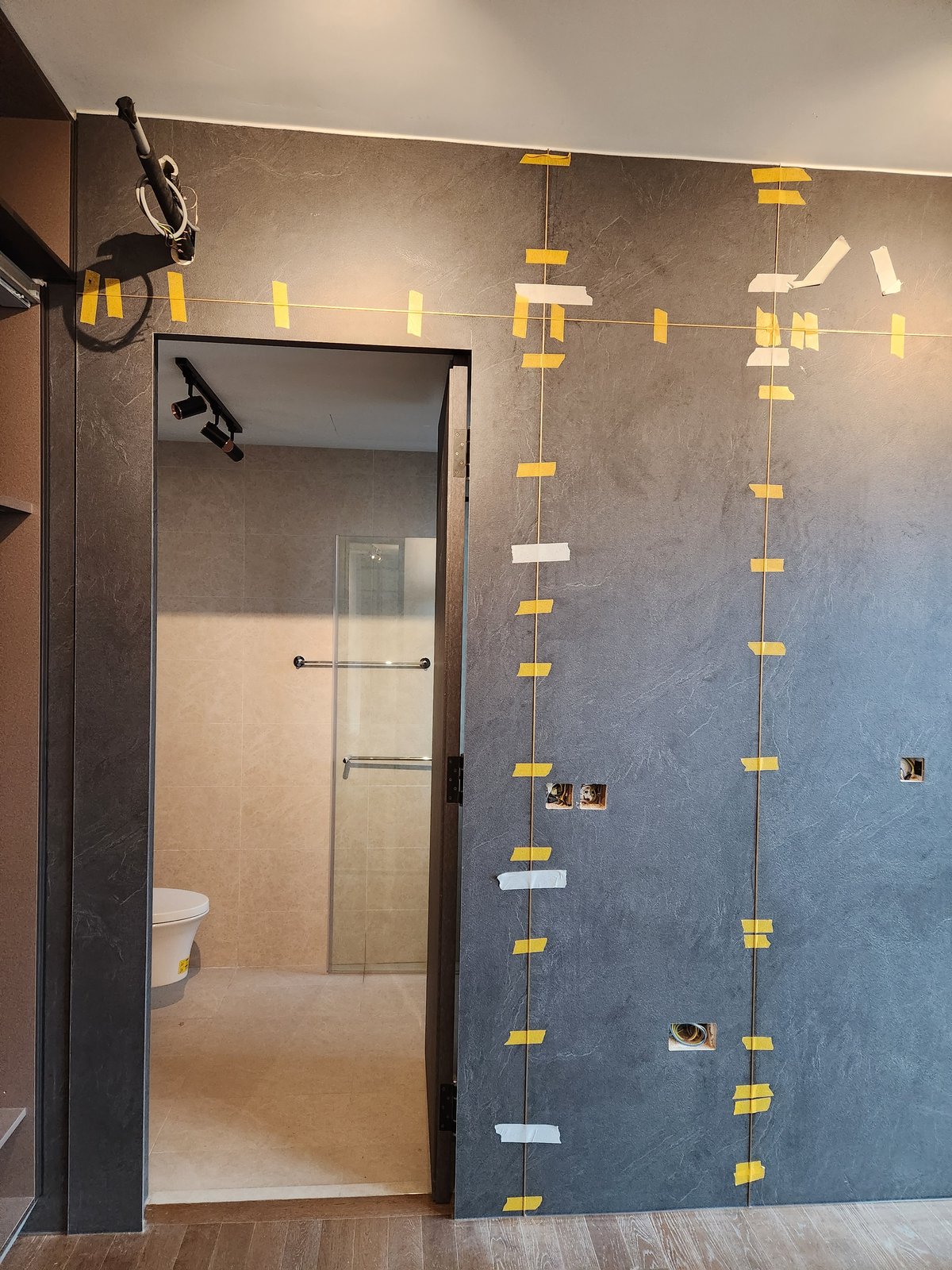 Integrated Glass, Aluminium & Metal Components in Imported Furniture: Why Luxury FF&E Needs Multi-Trade Installation Coordination in Singapore decorative metal component feature wall singapore