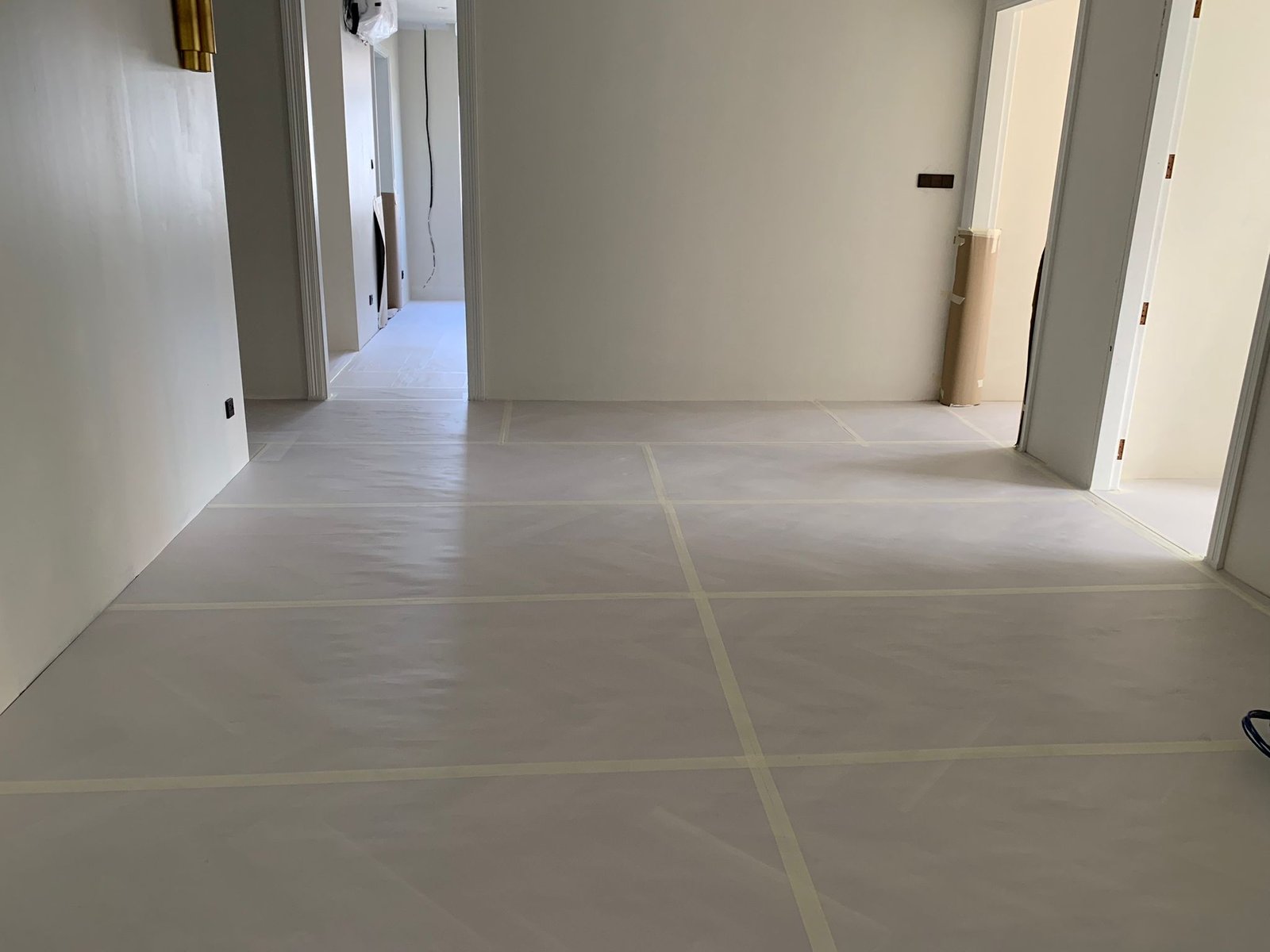 A&A Contractor in Singapore Empty unit with full floor protection taped at the seams