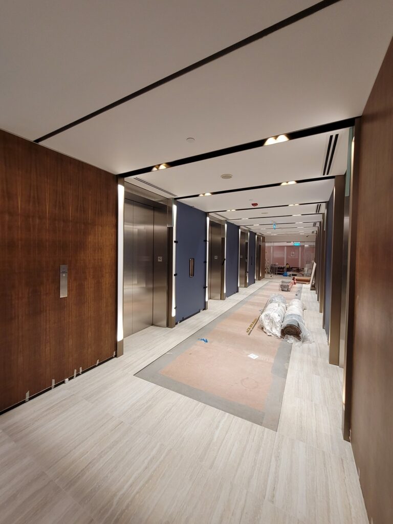 Permitted Hours, Lift Slots and Shutdowns: the Access Calendar That Sets an A&A Programme Lift lobby with floor protection and materials staged during works in an occupied building