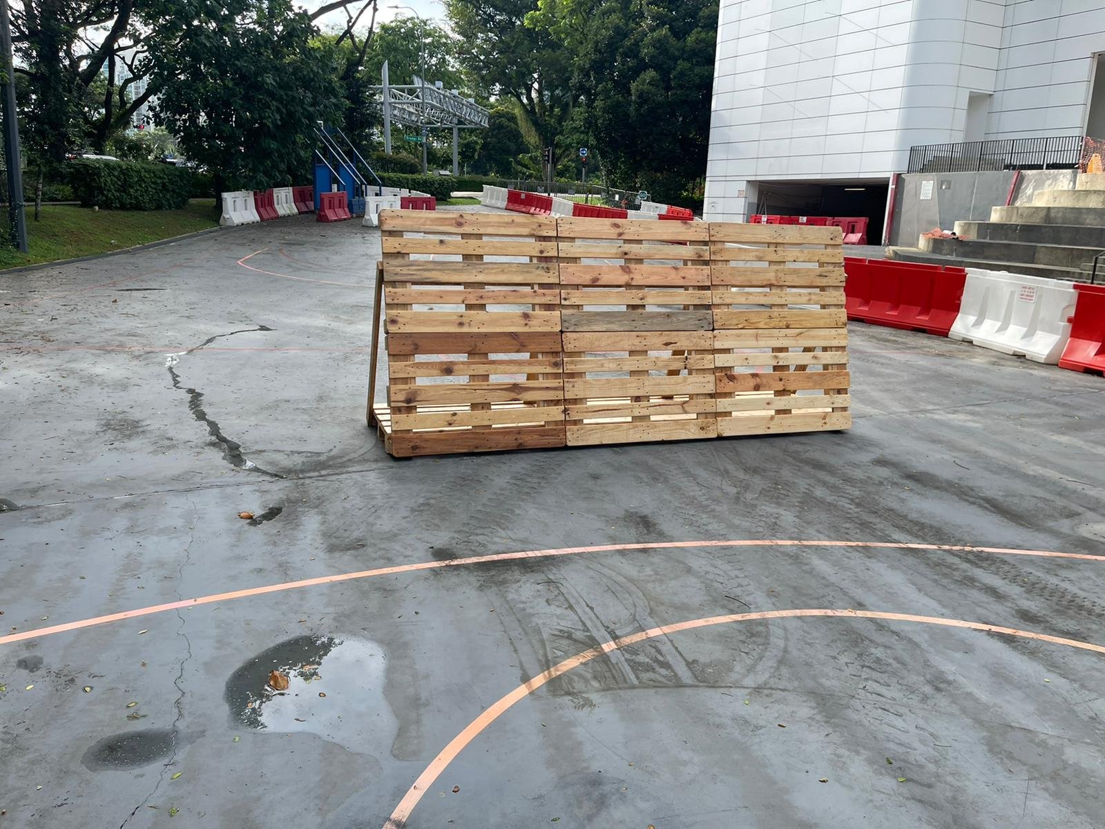 Permitted Hours, Lift Slots and Shutdowns: the Access Calendar That Sets an A&A Programme Palletised materials at a loading area waiting for a delivery slot