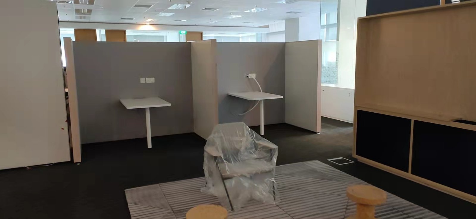 Discovered Scope: What Happens When You Open Up an Existing Building Office workstations protected and sheeted while alteration works continue nearby