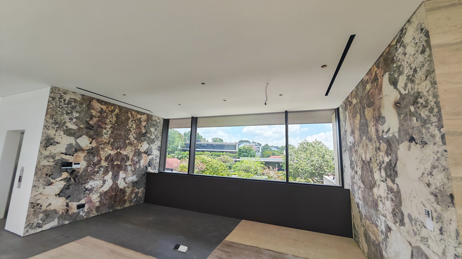 Stone Dry-Lay, Vein Matching & Final Templating for Imported Furniture in Singapore bookmatched stone feature wall singapore