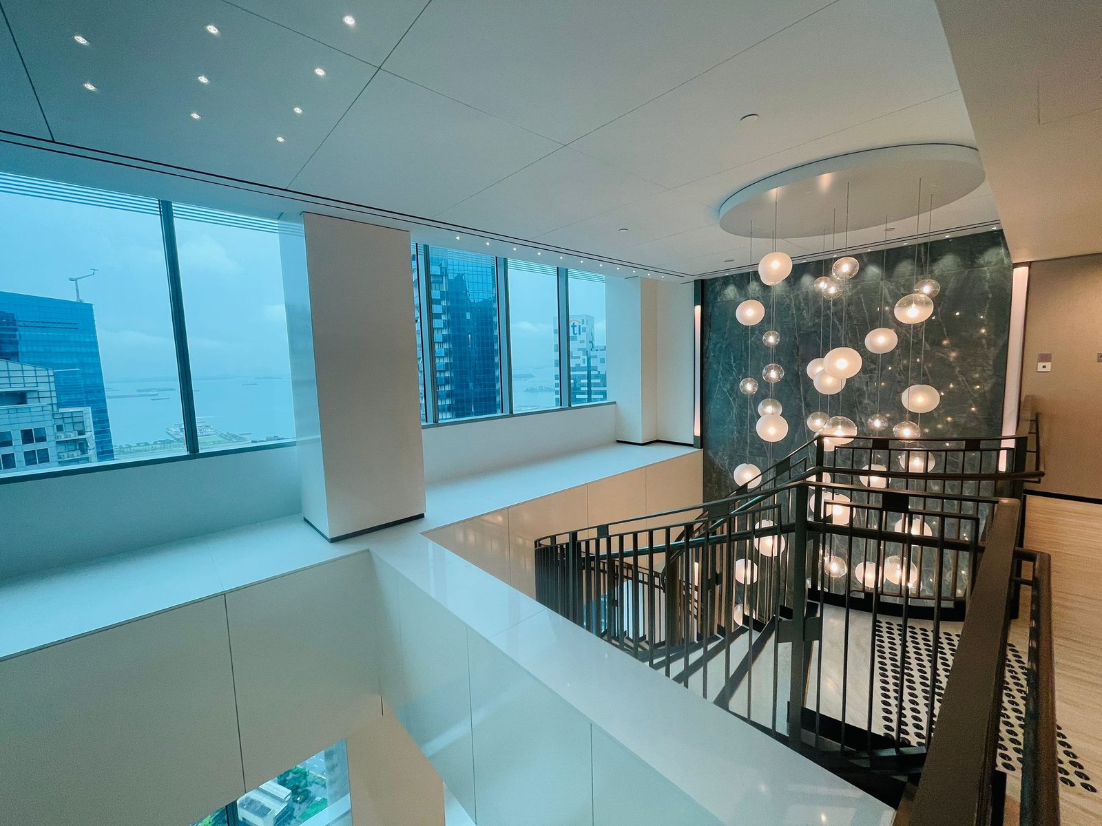Commercial Renovation Cost in Singapore: Where Does the Money Actually Go? double height glazed office interior completed singapore
