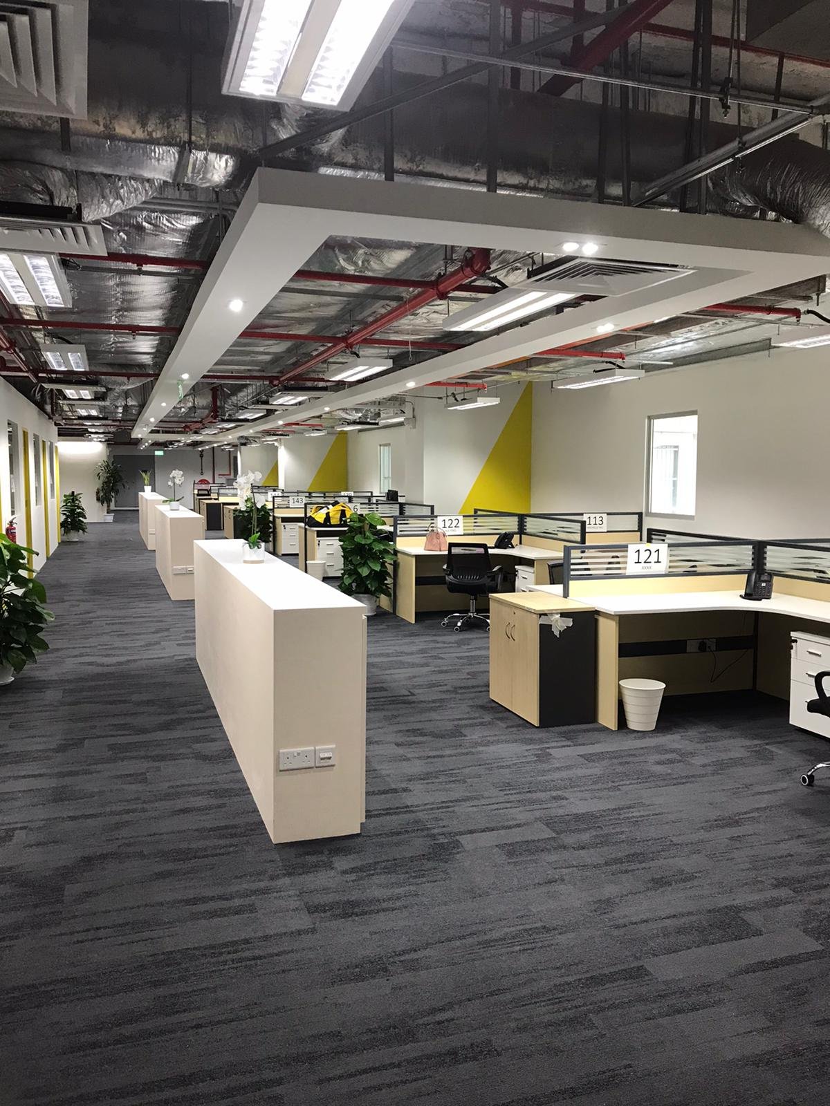 Builder's Works and Fit-Out Execution in Singapore: The Site Scope an Overseas Contractor Cannot Ship exposed ceiling services above office fit out singapore
