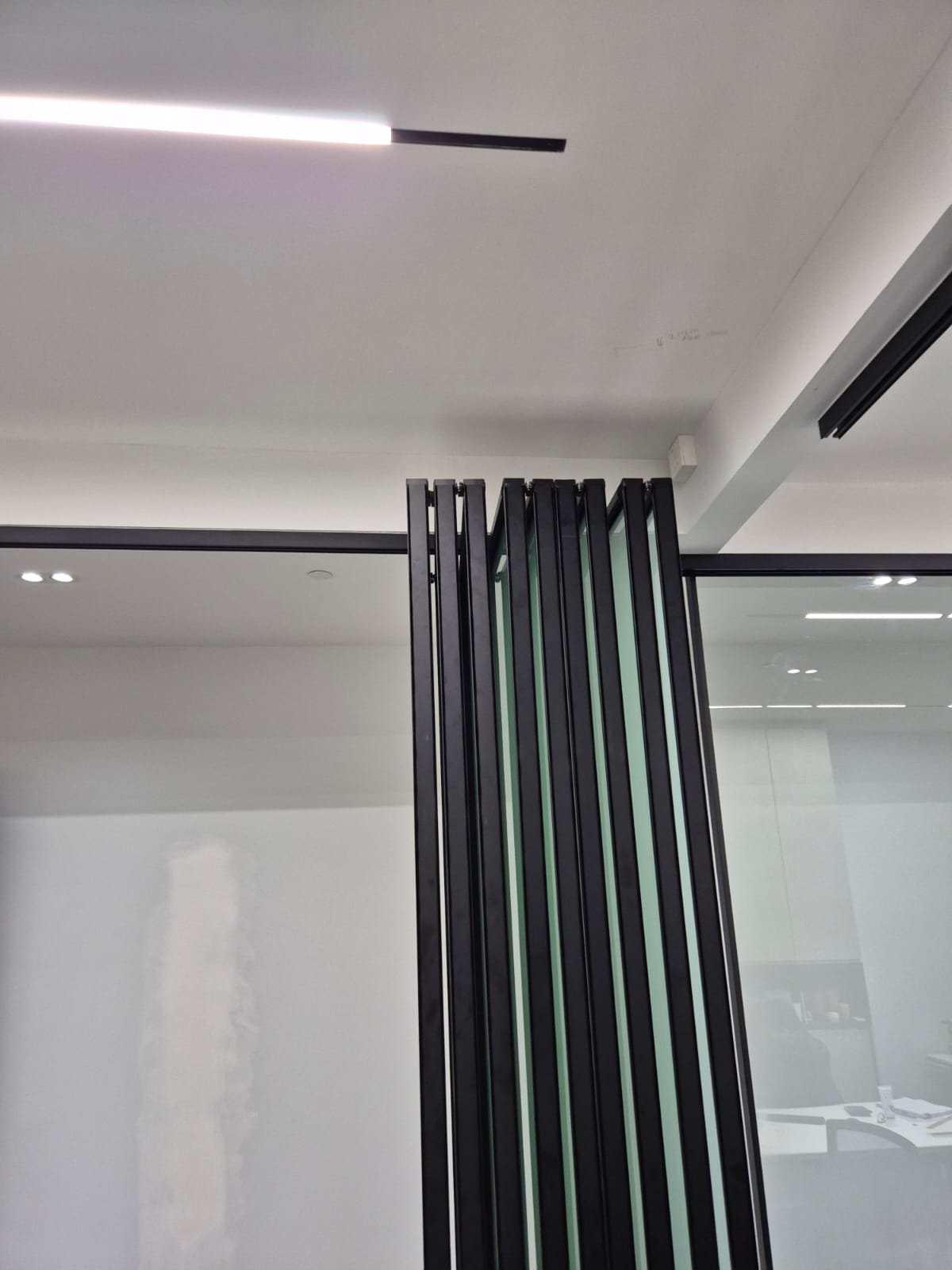 Imported Furniture Interface Coordination in Singapore: Who Is Responsible for Walls, M&E, Stone, Glass and Appliances? glass partition track interface singapore