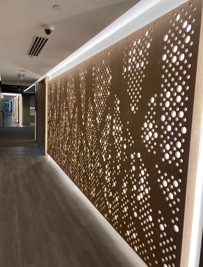Progress Claims, Retention and the Final Account on a Singapore Fit-Out backlit perforated timber feature wall in a completed Singapore office