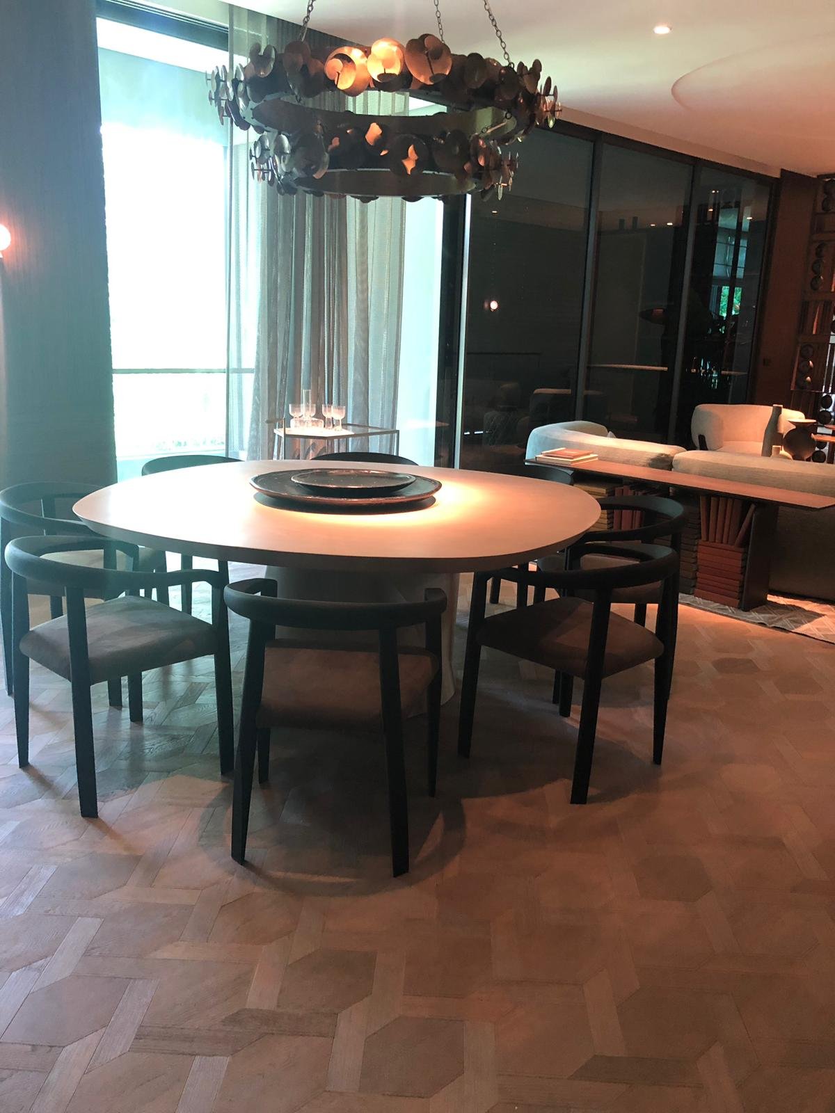 private dining room with a round table and feature lighting in Singapore
